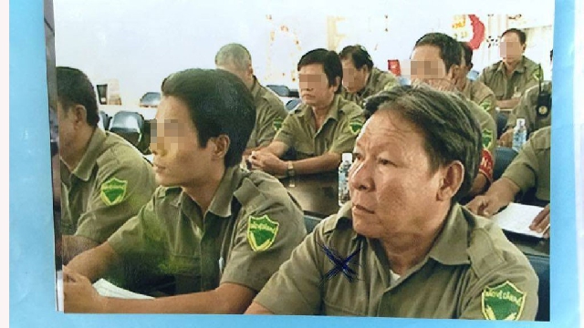 (C) thanhnien, テレビに映ったタン容疑者(右)